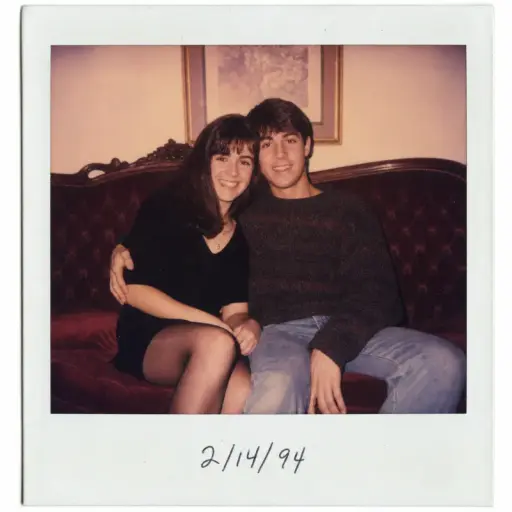 Retro polaroid AI couple photo prompt result — 1990s film tint on a vintage burgundy sofa