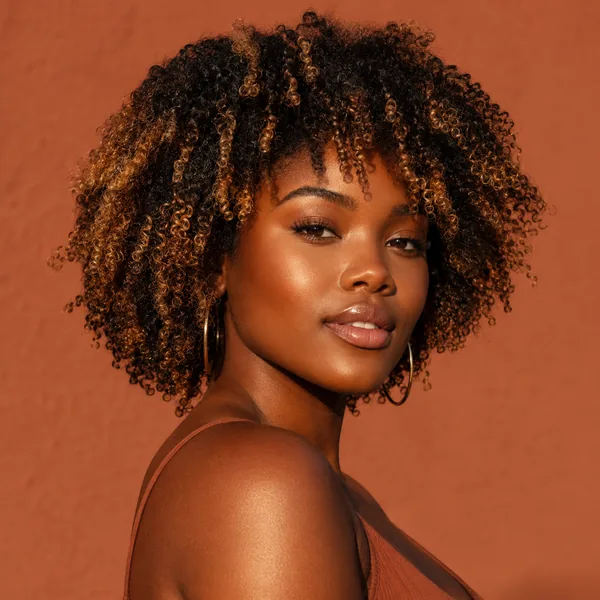 AI hair color changer on Black natural hair with honey-blonde tips