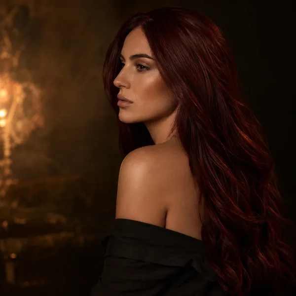 AI hair color changer rendering a deep burgundy red hair color
