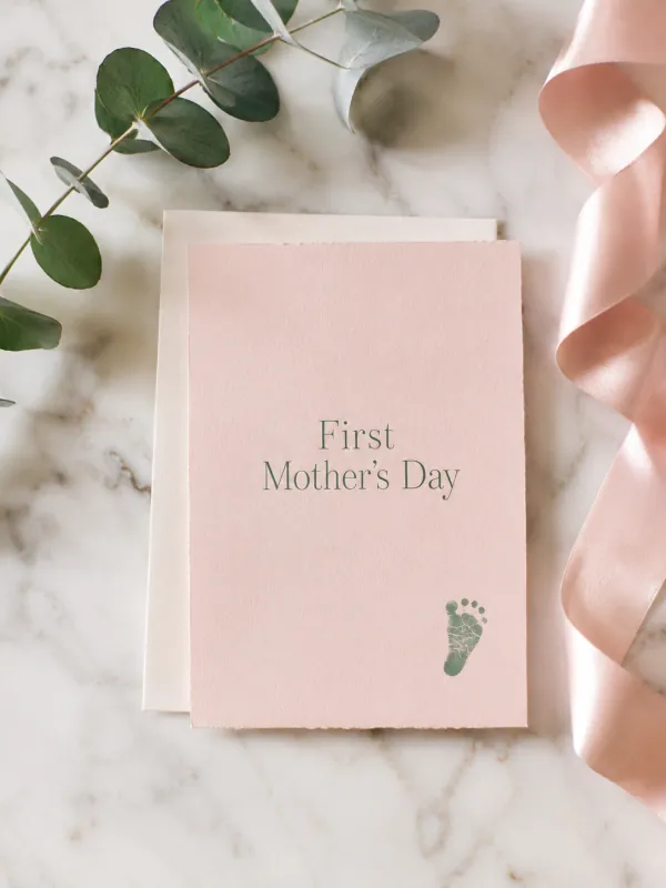 Pastel First Mother's Day card with a baby footprint and eucalyptus sprig