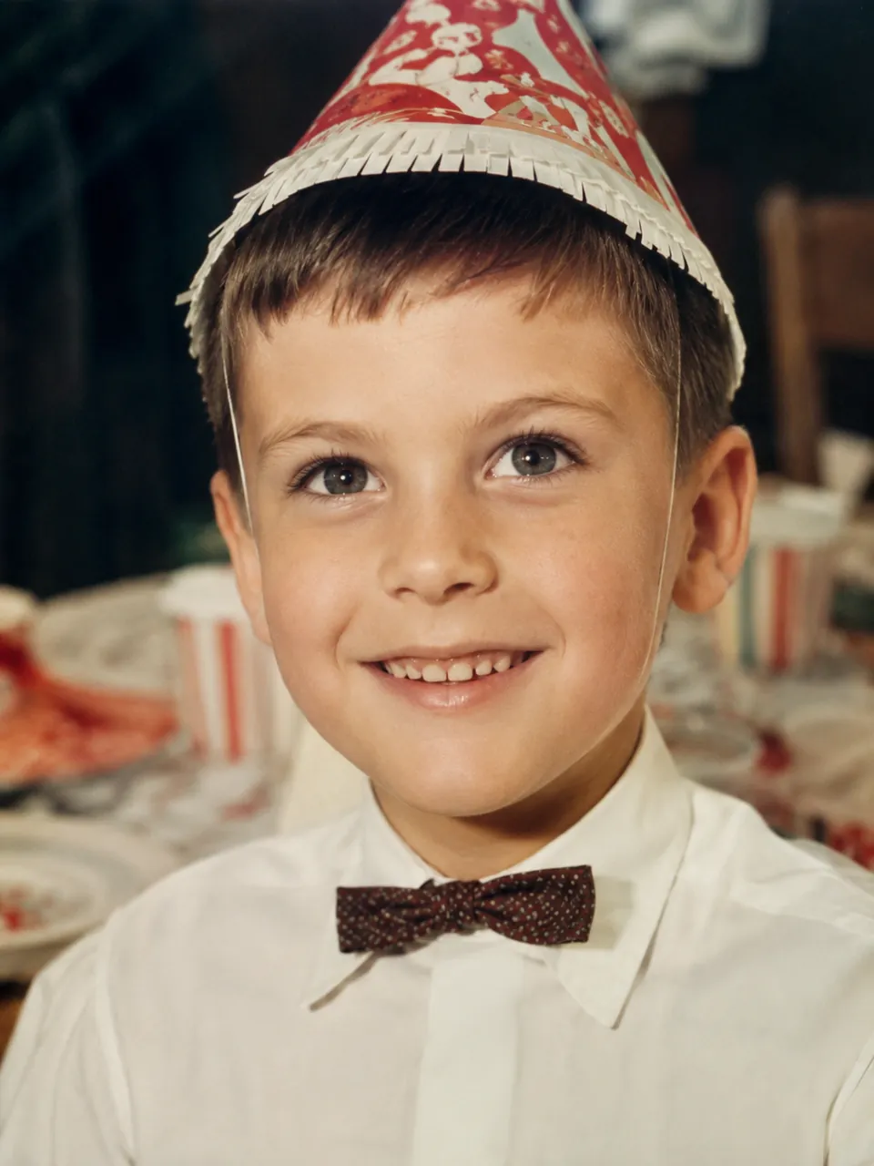 After restoration — the 1960s child portrait sharpened with crisp facial detail by the AI old photo restoration tool