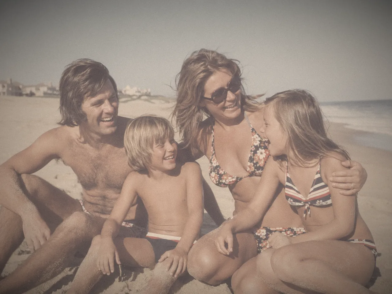 Before — a badly faded 1970s family beach photo with a heavy orange color cast