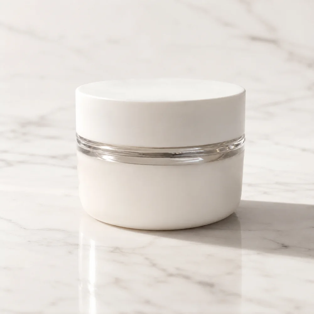 After — a studio-quality AI product mockup of the cosmetic cream jar on white marble