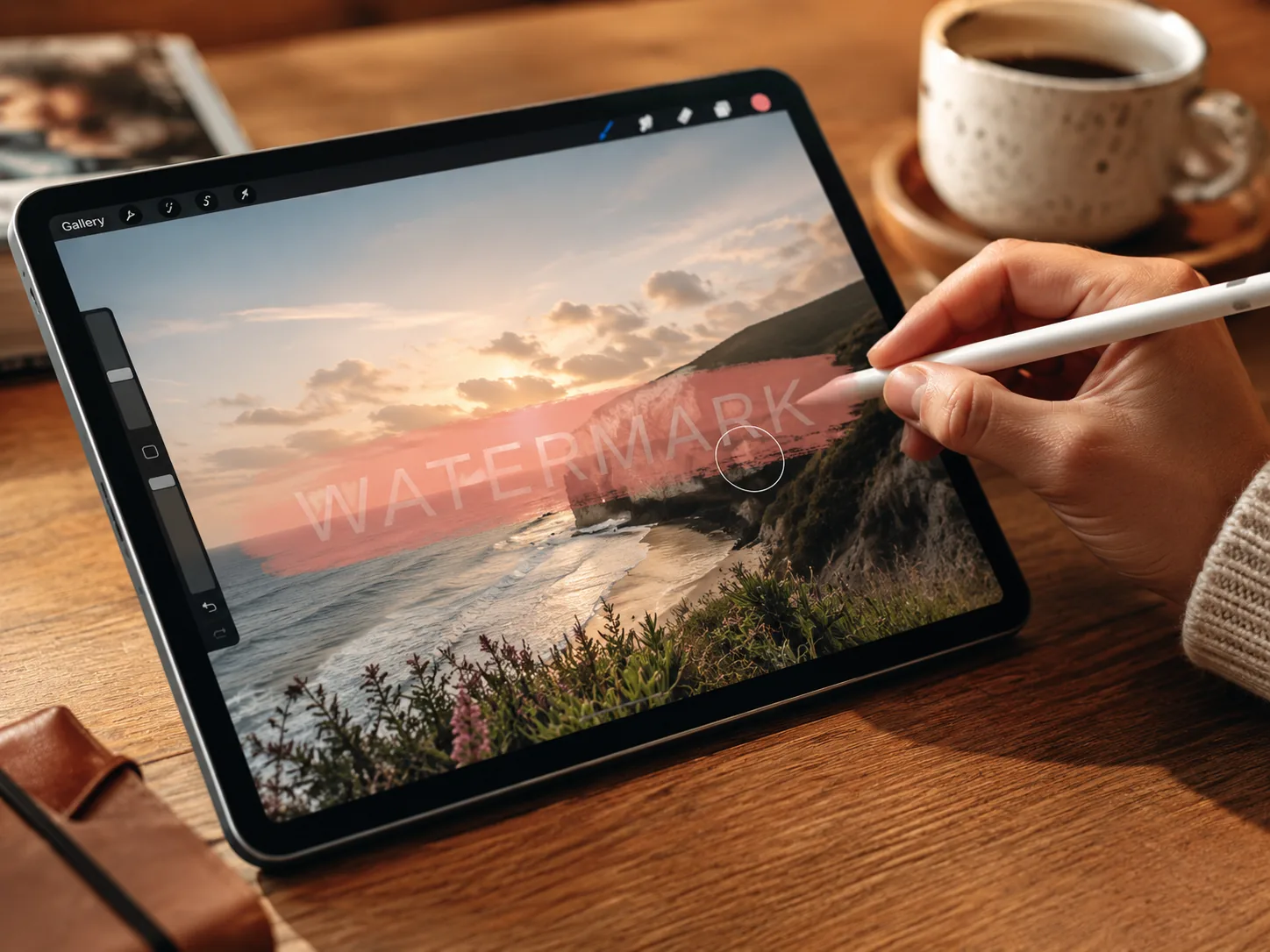 Step 2 of the AI watermark remover — brushing over a text watermark on a tablet