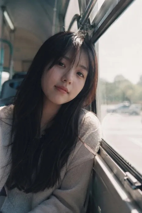 GPT Image 2 sample — Japanese film-girl portrait by bus window