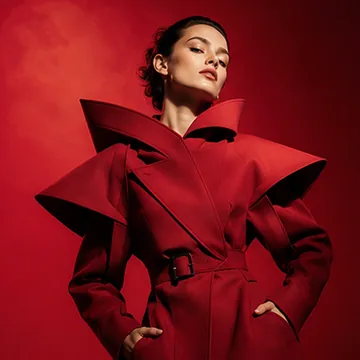 Seedream 4.0 high-fashion editorial of a model in a red structured coat