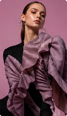 High-fashion editorial photo of a model against a colored backdrop
