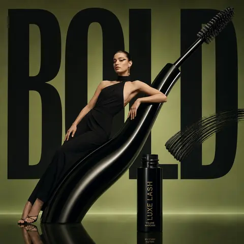 Avant-garde beauty close-up featuring an oversized mascara wand
